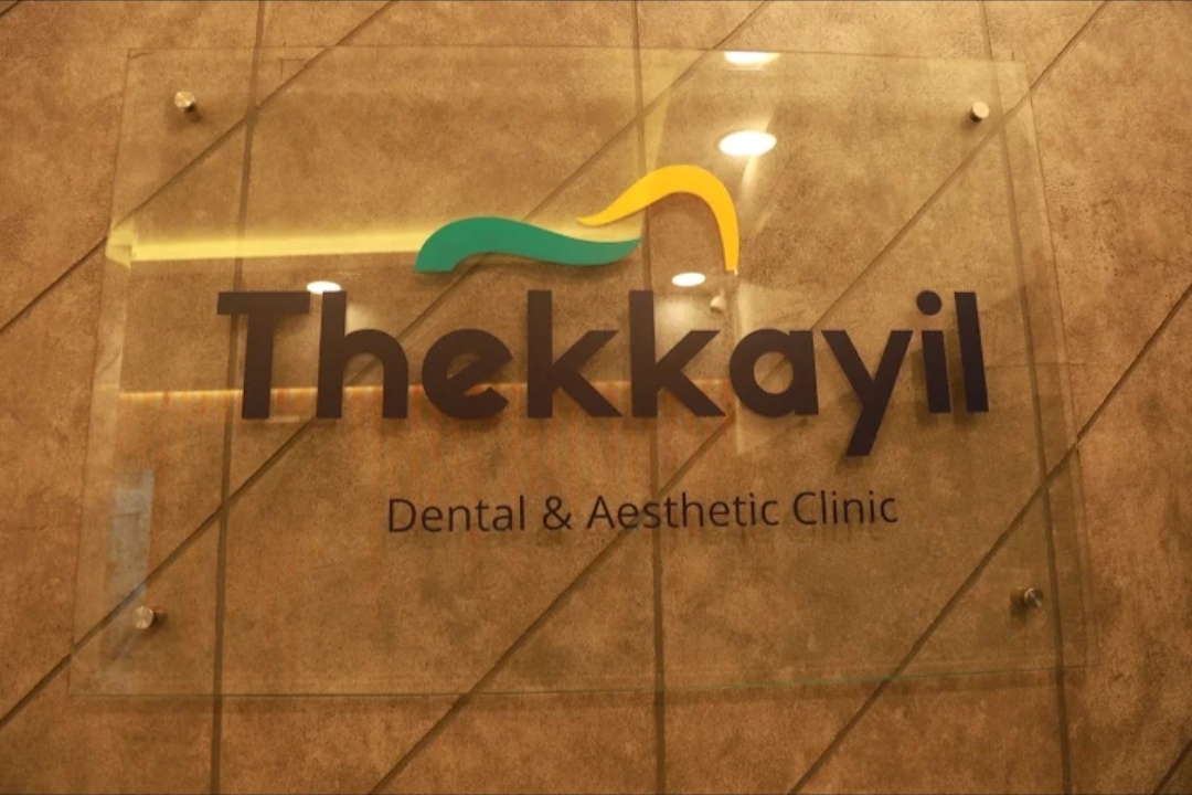Thekkayil Dental & Aesthetic Clinic glass name plaque